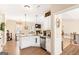 Modern kitchen boasts granite counters, stainless appliances, and seamlessly connects to the living area at 275 Cedars Glen Cir, Villa Rica, GA 30180