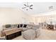 Spacious living room with a large sectional sofa and a view of the staircase at 275 Cedars Glen Cir, Villa Rica, GA 30180