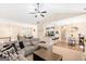 Open concept living room showcasing kitchen, dining area, and comfortable sectional sofa at 275 Cedars Glen Cir, Villa Rica, GA 30180