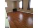 Spacious bedroom features hardwood flooring and plenty of natural light from the windows at 2563 Highway 81 E, Mcdonough, GA 30252