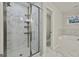 Bathroom featuring glass-enclosed shower with tiled walls and separate tub at 205 Valley View Dr, Tyrone, GA 30290