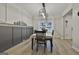 Bright dining room with modern light fixture and window view at 205 Valley View Dr, Tyrone, GA 30290
