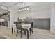 Dining room featuring modern lighting, table, and dining chairs at 205 Valley View Dr, Tyrone, GA 30290