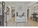 Light-filled foyer with hardwood floors, stylish console table and decor leading to dining area at 205 Valley View Dr, Tyrone, GA 30290