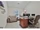 Home office with large desk, comfortable chair, and bright natural light at 205 Valley View Dr, Tyrone, GA 30290