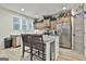 Kitchen featuring stainless steel appliances and an island with seating at 205 Valley View Dr, Tyrone, GA 30290