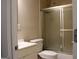 A brightly lit bathroom with a single vanity and glass enclosed shower at 61 Scoby Ct, Jonesboro, GA 30238