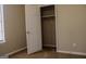 An interior shot of a bedroom displaying an open closet at 61 Scoby Ct, Jonesboro, GA 30238