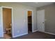 Bedroom featuring an attached bathroom and closet offering ample storage space at 61 Scoby Ct, Jonesboro, GA 30238
