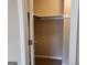 Organized closet with shelves and clothing rod for storage at 61 Scoby Ct, Jonesboro, GA 30238