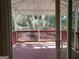 View of the red-railed deck, accessible through sliding glass doors at 61 Scoby Ct, Jonesboro, GA 30238
