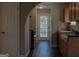 Kitchen features dark countertops, wood cabinets and black appliances at 61 Scoby Ct, Jonesboro, GA 30238