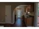 Kitchen with dark countertops, wood cabinets and black appliances at 61 Scoby Ct, Jonesboro, GA 30238