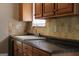 Close-up of kitchen countertop and backsplash at 61 Scoby Ct, Jonesboro, GA 30238
