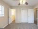 Inviting bedroom featuring a ceiling fan, new carpet, and ample closet space at 3465 Tulip Dr, Decatur, GA 30032