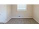 Comfortable bedroom with neutral carpeting, large window and neutral walls, creating a tranquil space at 3465 Tulip Dr, Decatur, GA 30032