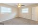 Cozy bedroom featuring neutral walls, plush carpeting, and a ceiling fan for added comfort at 3465 Tulip Dr, Decatur, GA 30032