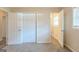 Bright bedroom with two closets, window and neutral colors at 3465 Tulip Dr, Decatur, GA 30032