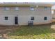 The exterior of the building features painted brick with a dark door and gated windows at 3465 Tulip Dr, Decatur, GA 30032