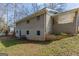 An expansive view of the building's exterior with a brick facade and lush lawn at 3465 Tulip Dr, Decatur, GA 30032
