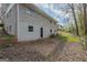A view of the building's painted brick exterior with secure windows and a door at 3465 Tulip Dr, Decatur, GA 30032