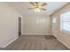 Spacious living room featuring a neutral color palette, plush carpet and a bright front entry door at 3465 Tulip Dr, Decatur, GA 30032