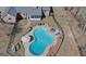 Aerial view of the home highlighting the pool, patio, brick exterior, and landscaping at 809 Mcbean Ct, Mcdonough, GA 30252
