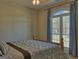 Bedroom featuring a large window, curtains, and neutral colored walls at 809 Mcbean Ct, Mcdonough, GA 30252
