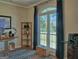Bright office with a large arched window, wood floors, and a built-in bookshelf at 809 Mcbean Ct, Mcdonough, GA 30252