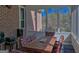 Relaxing screened porch featuring brick accent, dining table and chairs with a lovely view at 809 Mcbean Ct, Mcdonough, GA 30252