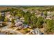 Beautiful aerial view of a neighborhood with manicured lawns, a tranquil lake, and established trees at 265 Ridgewood Dr, Fayetteville, GA 30215
