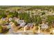 Stunning aerial view of a neighborhood with lush landscaping, mature trees, and a tranquil lake at 265 Ridgewood Dr, Fayetteville, GA 30215
