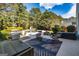 Inviting backyard with a pool, patio, lounge chairs, hot tub, and lush greenery for outdoor enjoyment at 265 Ridgewood Dr, Fayetteville, GA 30215