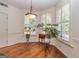 Sun-drenched breakfast nook with plantation shutters, hardwood floors, and decorative lighting at 265 Ridgewood Dr, Fayetteville, GA 30215