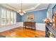Elegant dining room featuring wainscoting, chandelier, and wood floors at 265 Ridgewood Dr, Fayetteville, GA 30215