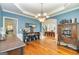 Spacious dining room showcasing hardwood floors, archway and view of the living spaces at 265 Ridgewood Dr, Fayetteville, GA 30215