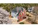 Charming brick home with a two-car garage, mature trees, and a professionally landscaped front yard at 265 Ridgewood Dr, Fayetteville, GA 30215
