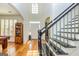 Bright foyer with staircase featuring elegant wood floors and neutral colors at 265 Ridgewood Dr, Fayetteville, GA 30215