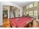 Spacious game room boasts a red felt pool table, and easy access to main entrance and living room at 265 Ridgewood Dr, Fayetteville, GA 30215