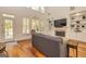 Bright living room with high ceilings, fireplace, built-in shelving, hardwood floors and lots of light at 265 Ridgewood Dr, Fayetteville, GA 30215