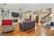 Bright living room with hardwood floors, fireplace, built-in shelving and open access to other rooms at 265 Ridgewood Dr, Fayetteville, GA 30215