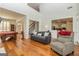 Open-concept living room with hardwood floors, open floor plan, high ceiling and easy access to kitchen at 265 Ridgewood Dr, Fayetteville, GA 30215