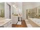 Luxurious bathroom with double vanity, soaking tub, and separate glass-enclosed shower at 265 Ridgewood Dr, Fayetteville, GA 30215
