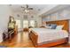 Spacious main bedroom with hardwood floors, large windows, a ceiling fan, and warm, natural light at 265 Ridgewood Dr, Fayetteville, GA 30215