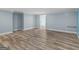 Finished basement featuring modern vinyl flooring, blue painted walls, and white trim at 142 Gillson Dr, Mcdonough, GA 30253