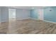 Finished basement features modern vinyl flooring, blue painted walls, and a white trim at 142 Gillson Dr, Mcdonough, GA 30253