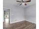 Bedroom with ceiling fan, wood-look floors, and neutral walls, offering a comfortable space at 142 Gillson Dr, Mcdonough, GA 30253
