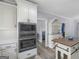 Kitchen with stainless steel microwave and oven, white cabinets, and a butcher block island at 142 Gillson Dr, Mcdonough, GA 30253