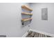 Laundry room with floating shelves, an electrical panel, and hardwood floors at 142 Gillson Dr, Mcdonough, GA 30253