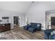 Open living room with hardwood floors, modern furniture, and plenty of natural light at 142 Gillson Dr, Mcdonough, GA 30253